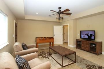 Downstairs Family Room includes Foosball Table, Television, DVD and VHS player.