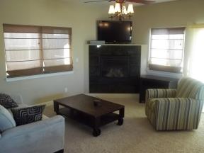 Upstairs Family Room includes a gas fireplace, television, Karaoke machine