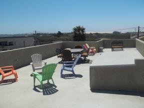 Large roof deck offers views of  lagoon, ocean and mountains.