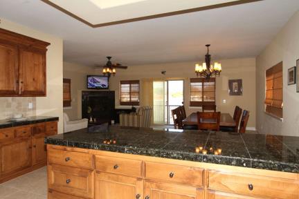 Upstairs kitchen bar provides a great place to serve snacks or meals